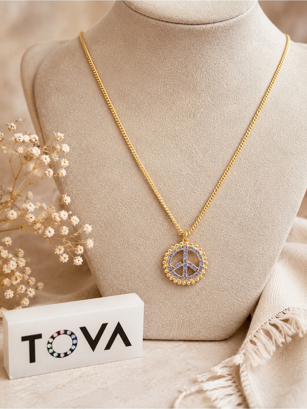 Tova Peace ☮️ Saphire blue crystal
On a Gold Chain Necklace..